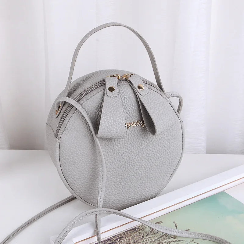 New handbag cute little round bag shoulder diagonal bag portable cosmetic bag foreign trade wholesale small bag. Women's bag